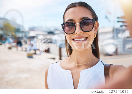 Travel, happy or woman taking selfie on holiday vacation in summer in Las Vegas, USA with freedom. Smile, fashion sunglasses or portrait of cool girl tourist taking pictures for social media content 127341082