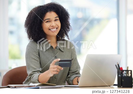 Credit card, laptop and black woman portrait in office for online shopping, fintech payment and finance employeer happy to invest savings. African woman, ecommerce web or internet banking on computer Credit card, laptop and black woman portrait in office for online shopping, fintech payment and finance employeer happy to invest savings. African woman, ecommerce web or internet banking on computer 127341228