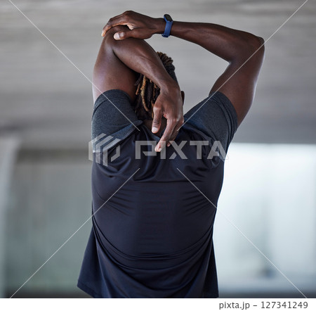 Black man, back and stretching fitness outdoor for sports workout, training warm up and runner exercise motivation. African athlete, arms stretch and cardio performance wellness or body muscle care 127341249