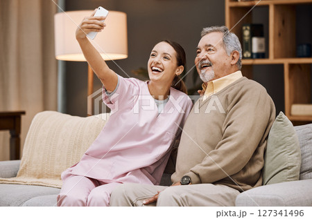 Nurse, selfie and old man in nursing home with smartphone and smile for picture, caregiver and retirement. Health, photography with phone and care, young woman and nursing with elderly man wellness. Nurse, selfie and old man in nursing home with smartphone and smile for picture, caregiver and retirement. Health, photography with phone and care, young woman and nursing with elderly man wellness. 127341496