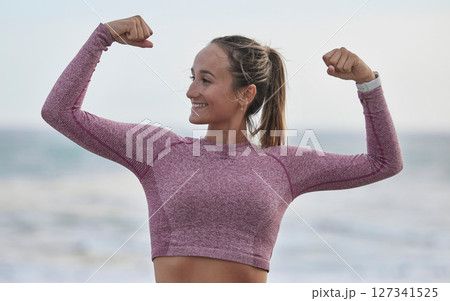 Strong, fitness and woman with muscle flex, exercise on beach and outdoor with nature, happy bodybuilder with power. Bodybuilding training, wellness and active female, fist and strength endurance Strong, fitness and woman with muscle flex, exercise on beach and outdoor with nature, happy bodybuilder with power. Bodybuilding training, wellness and active female, fist and strength endurance 127341525