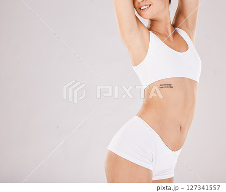 Diet, woman and underwear for healthy lifestyle, skincare and exercise on grey studio background. Female, girl and workout for wellness, motivation and health care for body care, fitness and beauty Diet, woman and underwear for healthy lifestyle, skincare and exercise on grey studio background. Female, girl and workout for wellness, motivation and health care for body care, fitness and beauty 127341557