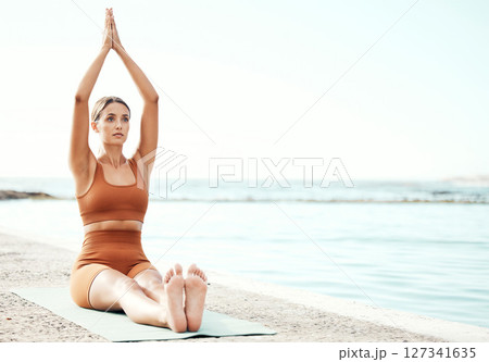Fitness, yoga and zen, woman at beach stretching for meditation and training in nature for healthy lifestyle. Health, wellness and workout for girl at ocean, pilates exercise for balance at sea water 127341635