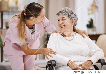 Healthcare, support and caregiver with senior woman for medical help, elderly care and consulting patient. Wheelchair disability, rehabilitation and nurse volunteer at nursing home for charity work 127341659