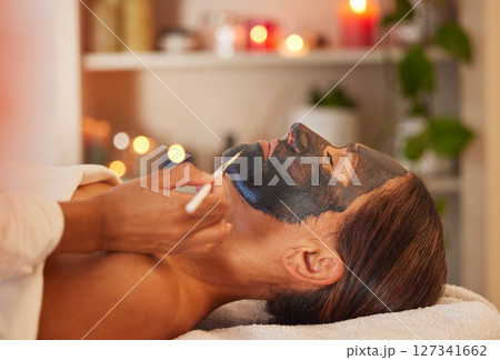Spa, woman and charcoal face mask, skincare and face detox for health, wellness and clear skin. Beauty, cosmetics and girl with organic facial, luxury and detox for confidence, and relax treatment 127341662