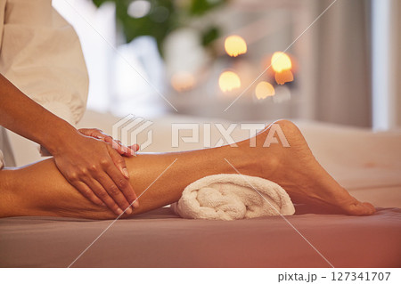 Spa, hands and legs massage for relax, health and wellness at luxury resort. Zen, physical therapy and woman or female .therapist massaging leg of person on table for skincare, body care and beauty. Spa, hands and legs massage for relax, health and wellness at luxury resort. Zen, physical therapy and woman or female .therapist massaging leg of person on table for skincare, body care and beauty. 127341707