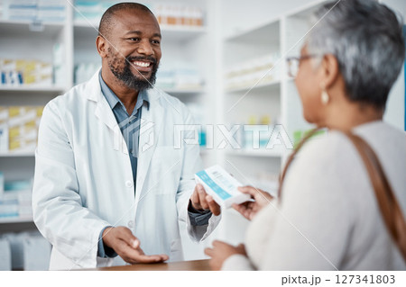 Healthcare, pharmacist and woman at counter with medicine or prescription drugs in hands at drug store. Health, wellness and medical insurance, man and customer at pharmacy for advice and pills. 127341803