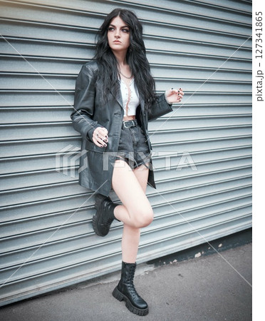 Young woman, fashion and streetwear with gen z punk style, outdoor and trendy, edgy and stylish in urban city. Youth, focus and beauty with rock aesthetic, fashion model in designer clothes in London 127341865