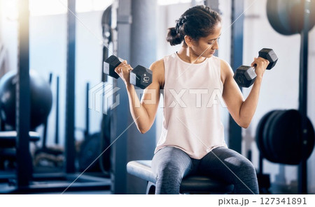 Fitness, dumbbell and training with woman at gym for weightlifting, health and sports workout. Energy, challenge and performance with girl bodybuilder lifting weights for muscle, strong and muscle 127341891