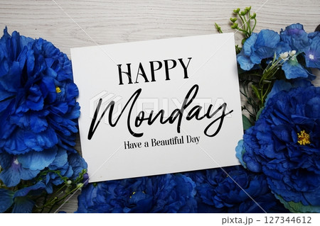 Happy Monday Have a Beautiful Day text with blue flowers bouquet decoration on wooden background Happy Monday Have a Beautiful Day text with blue flowers bouquet decoration on wooden background 127344612