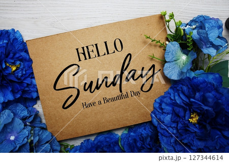 Happy Sunday Have a Beautiful Day text with blue flowers bouquet decoration on wooden background 127344614