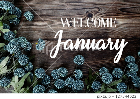 Welcome January text with flowers bouquet decoration on wooden background Welcome January text with flowers bouquet decoration on wooden background 127344622