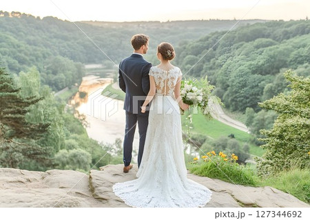 Newlyweds Embrace Scenic Vista: A Romantic Wedding Moment Overlo 127344692
