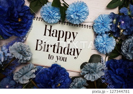 Happy Birthday to you text with blue flowers bouquet decoration on wooden background Happy Birthday to you text with blue flowers bouquet decoration on wooden background 127344781