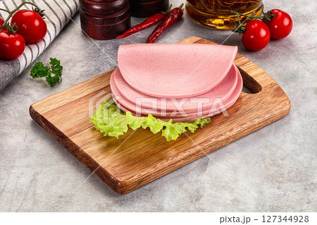 Sliced boiled sausage over board Sliced boiled sausage over board 127344928