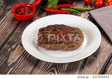 Grilled beef burger cutlet with sauce 127345031