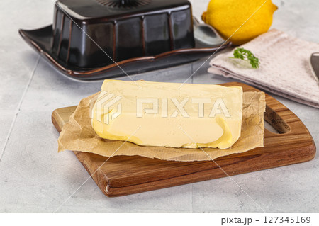 Dairy butter piece over board 127345169