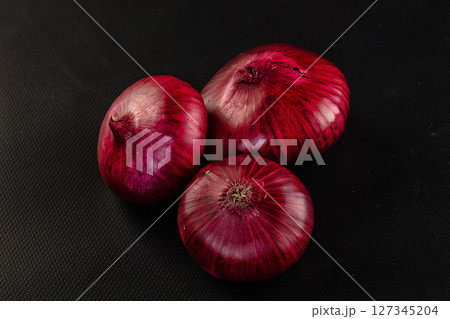 Raw ripe purple onion bulb 127345204
