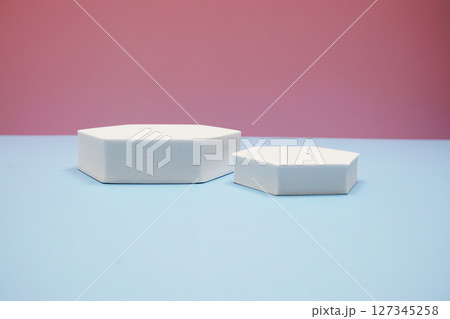 Podium display scene stage showcase front view with copy space on pink and blue background 127345258