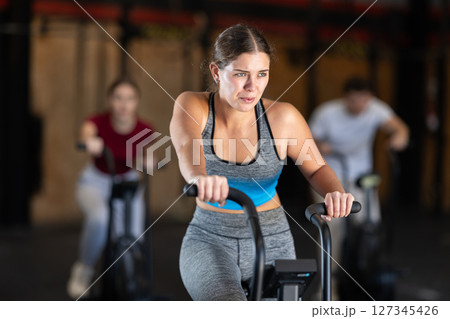 Woman in the top is engaged in an airbike 127345426