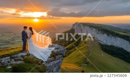Mountain Top Wedding: Bride and Groom at Sunset with Dramatic Cl 127345609