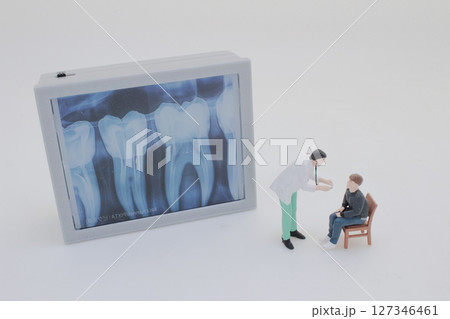 Mini Doctors Analyzing Medical X Rays in Clinical Setting Mini Doctors Analyzing Medical X Rays in Clinical Setting 127346461
