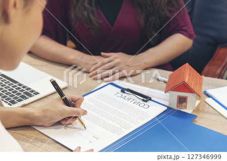 Close up Team Businesswoman hands partners sign contract with success business deal. Diversity Businesswoman teams handshake together. Partnership teamwork meeting signing contract business concept 127346999