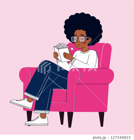 Woman Relaxing in Armchair with Popcorn Woman Relaxing in Armchair with Popcorn 127348923
