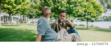 Handsome mature man talking with his older father. 127349774