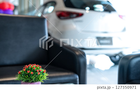 Car parked in luxury showroom. Car dealership office. Car showroom business. New car parked in modern showroom. Auto for sale and rent business. Automobile leasing and insurance. Electric automobile. Car parked in luxury showroom. Car dealership office. Car showroom business. New car parked in modern showroom. Auto for sale and rent business. Automobile leasing and insurance. Electric automobile. 127350971