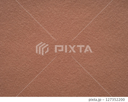 An inviting landscape of terracotta felt, the surface exudes the warmth of earthenware in the soft afternoon glow An inviting landscape of terracotta felt, the surface exudes the warmth of earthenware in the soft afternoon glow 127352200