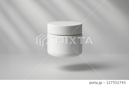 White cosmetic jar mockup with blank label for clean minimalist packaging design floating in air perfect for beauty product branding presentation White cosmetic jar mockup with blank label for clean minimalist packaging design floating in air perfect for beauty product branding presentation 127352743