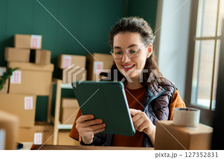 Woman working in a warehouse 127352831