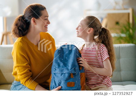Happy family preparing for school Happy family preparing for school 127352927