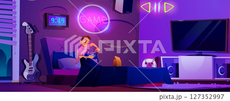 Teen boy sitting in bed and opening sci-fi cube 127352997