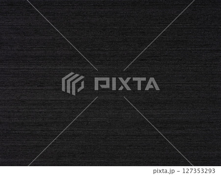 Gabon ebony veneer surface with a luxurious obsidian essence and a sleek, textured finish 127353293