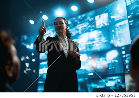 A woman is speaking on stage A woman is speaking on stage 127353955