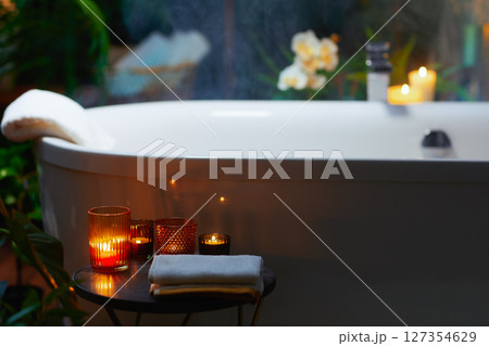 Luxurious Candlelit Bathtub in a Serene Bathroom Luxurious Candlelit Bathtub in a Serene Bathroom 127354629