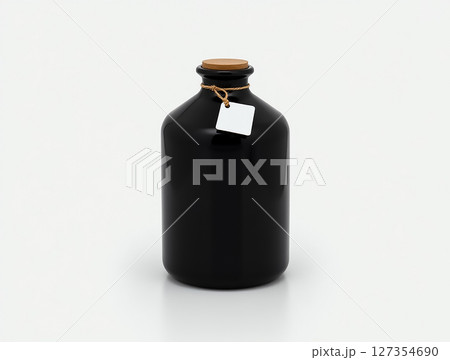 Elegant black glass bottle with cork lid on a minimalist background showcasing simple design and style 127354690