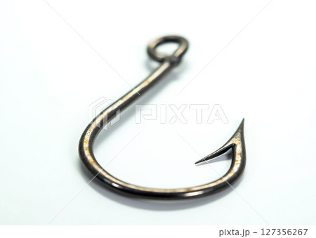 Unique fish hook with sharp barb designed for catching fish in freshwater and saltwater environments Unique fish hook with sharp barb designed for catching fish in freshwater and saltwater environments 127356267