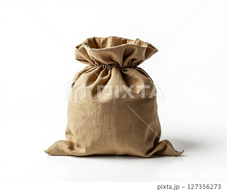 Natural fabric bag filled with goods displayed on a clean white background 127356273
