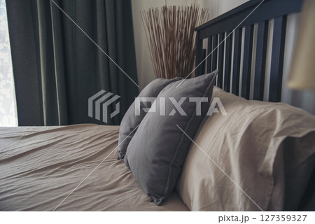 Blur background bedroom home interior in cozy decoration room. Clean soft bed stylish decor relax dorm with copy space. Modern apartment white light trendy style. Blurred background defocused indoors 127359327