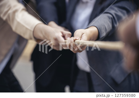 Tug of war Businesswoman Team holding hands together partnership leader teamwork. Group of business people Hands pulling rope symbol team unified teamwork Partnership Concept. diversity competition Tug of war Businesswoman Team holding hands together partnership leader teamwork. Group of business people Hands pulling rope symbol team unified teamwork Partnership Concept. diversity competition 127359380