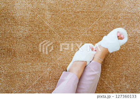 soft white slippers on the beige Interior pile carpet. 127360133