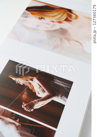 the pages of a photo book with wedding photos. the pages of a photo book with wedding photos. 127360179