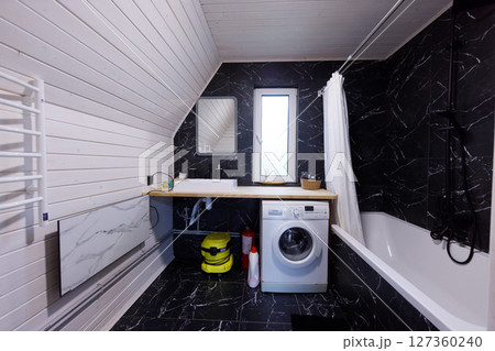 Stylish Modern Bathroom Featuring Elegant Design Elements and Functional Appliances in a Contemporary Space with Modern Finishes and Textures Stylish Modern Bathroom Featuring Elegant Design Elements and Functional Appliances in a Contemporary Space with Modern Finishes and Textures 127360240