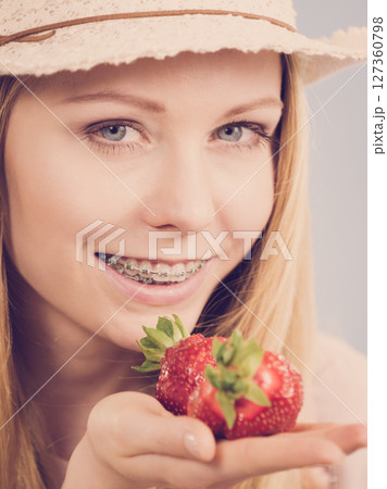 Young woman with fresh strawberries 127360798