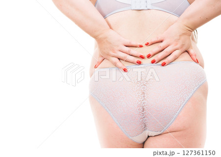 Plus size woman in lingerie back view. 127361150