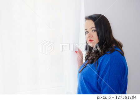 Plus size adult woman portrait Plus size adult woman portrait 127361204