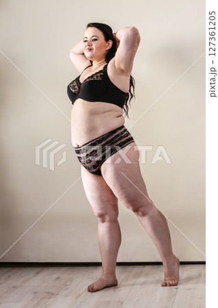 Plus size model wearing black lingerie 127361205